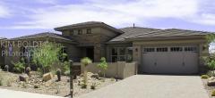 A large one-story house with two garage doors
