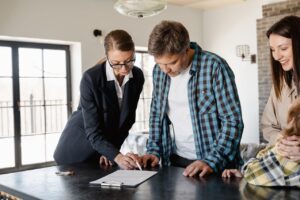 A real estate agent explaining a document to a couple